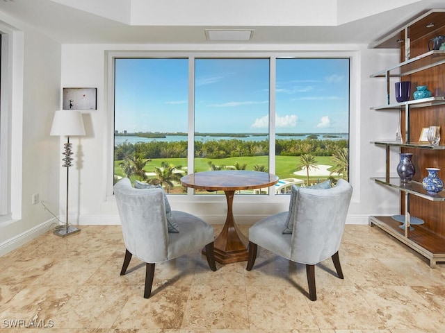 dining room featuring a water view