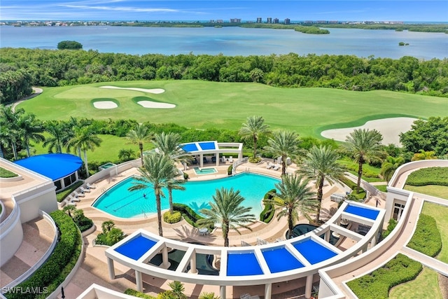 view of swimming pool featuring a water view