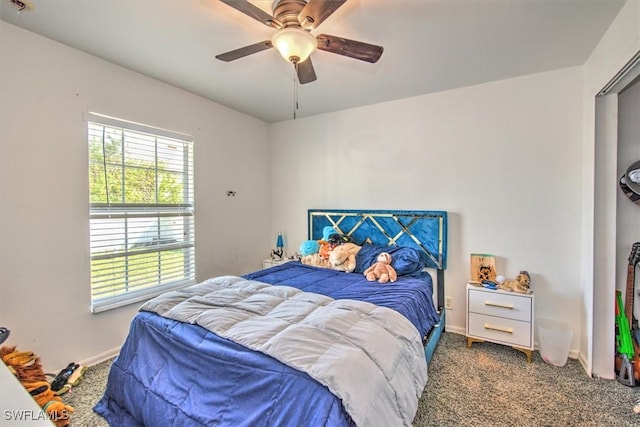 carpeted bedroom featuring ceiling fan