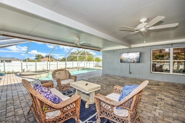 view of patio with glass enclosure and a pool with hot tub