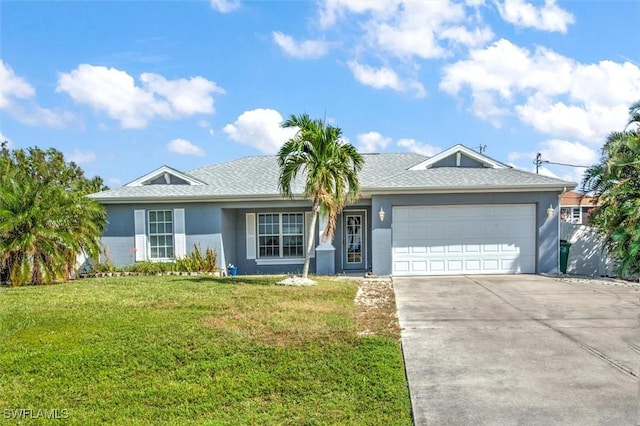 single story home featuring a garage and a front yard