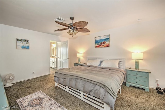 bedroom featuring ceiling fan, ensuite bathroom, and dark carpet