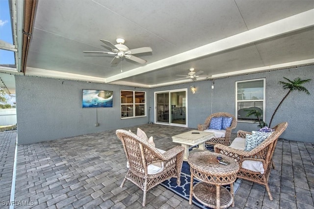 view of patio featuring an outdoor hangout area and ceiling fan