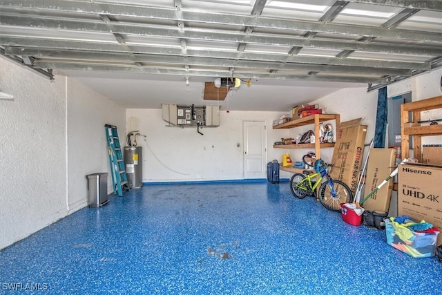 garage featuring electric water heater and a garage door opener