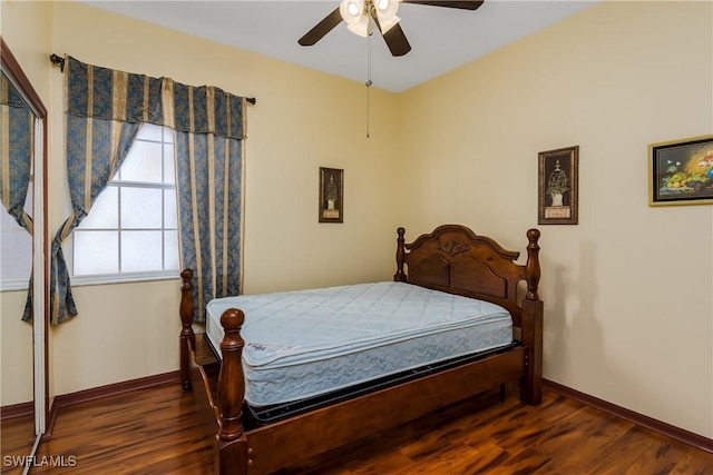 bedroom featuring ceiling fan and dark wood-type flooring