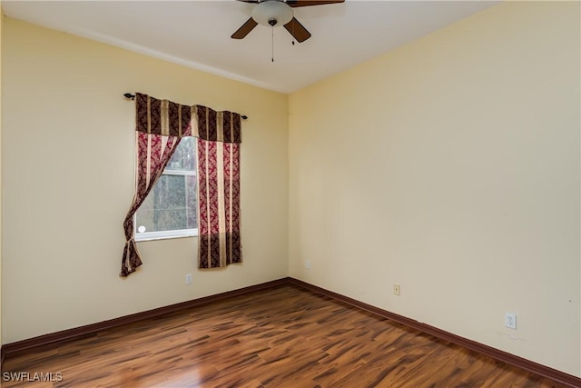 spare room with hardwood / wood-style floors and ceiling fan