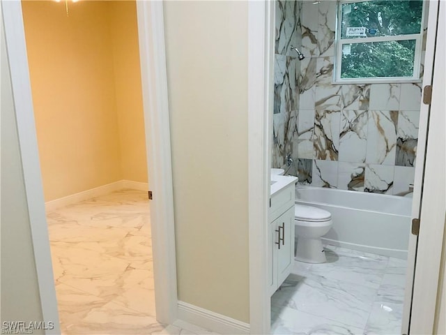 full bathroom with tiled shower / bath, vanity, and toilet