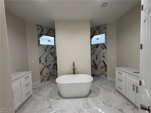 bathroom with vanity, tile walls, and plus walk in shower