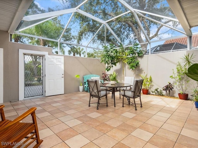 view of patio / terrace featuring a lanai