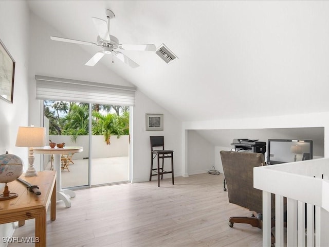 interior space with ceiling fan, lofted ceiling, and light wood-type flooring