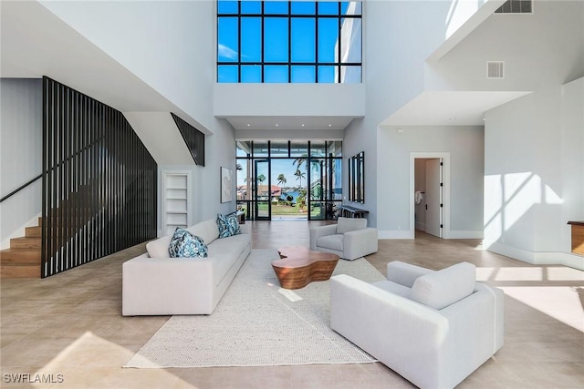 living room featuring a high ceiling