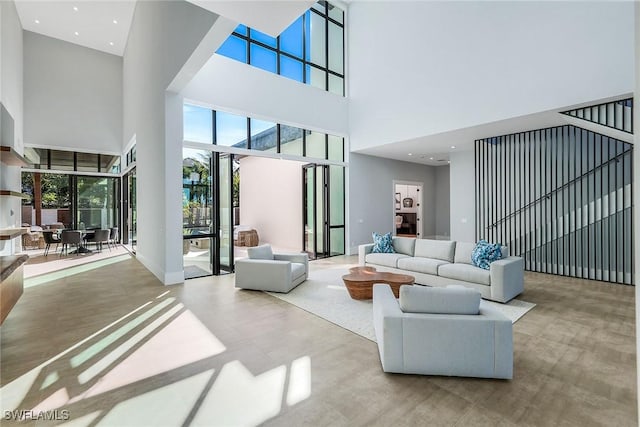 living room with a high ceiling