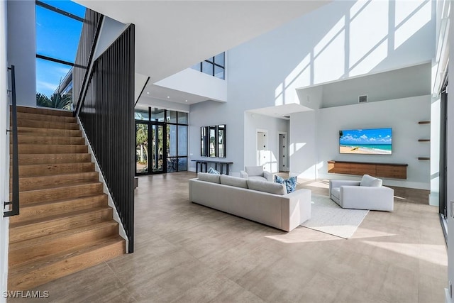 living room featuring a high ceiling