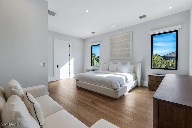 bedroom with light hardwood / wood-style floors