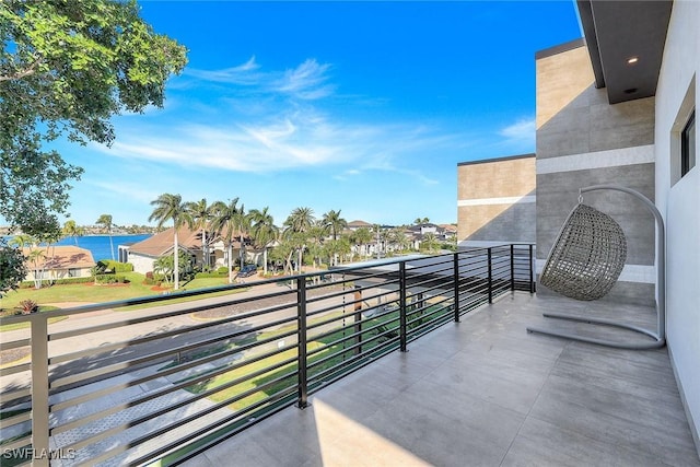 balcony featuring a water view