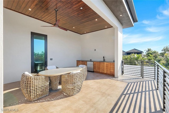 view of patio / terrace featuring ceiling fan, sink, and an outdoor kitchen