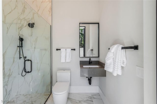 bathroom featuring toilet, a shower with door, and sink