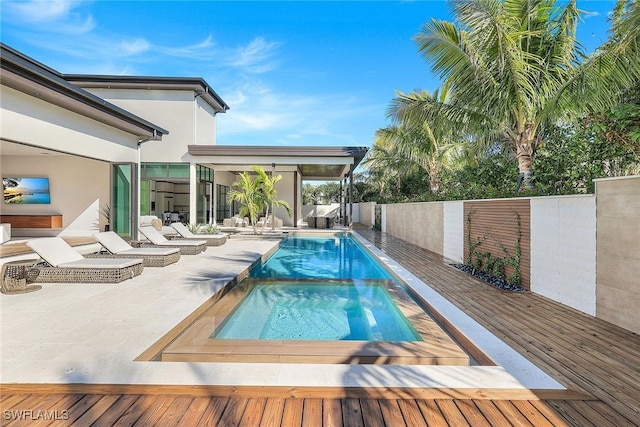 view of swimming pool featuring a deck