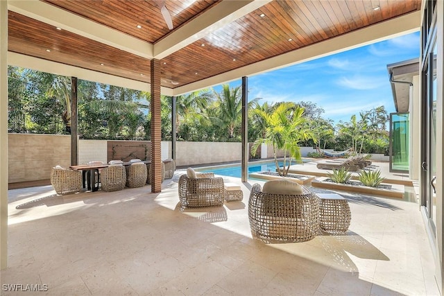 view of patio / terrace featuring a fenced in pool