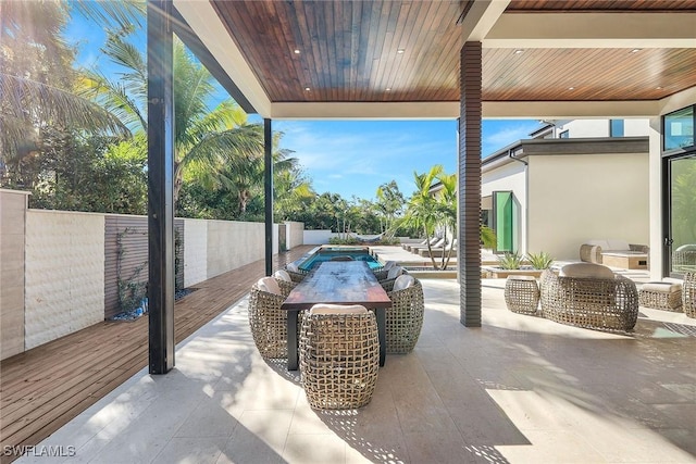 view of patio / terrace featuring a swimming pool side deck