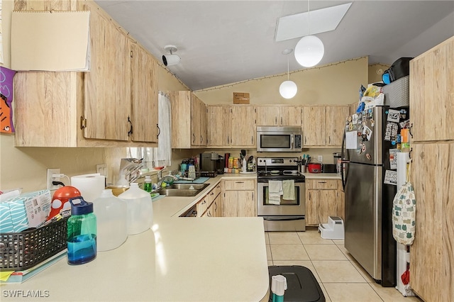 kitchen with appliances with stainless steel finishes, lofted ceiling with skylight, sink, light brown cabinets, and light tile patterned floors