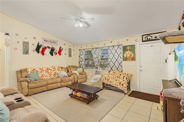 living room with ceiling fan and light tile patterned floors