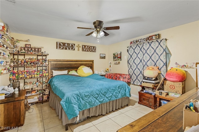 bedroom featuring light tile patterned floors and ceiling fan