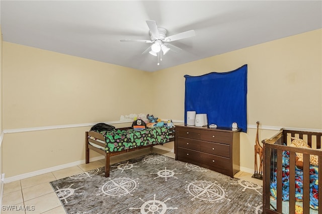 bedroom featuring ceiling fan and light tile patterned flooring