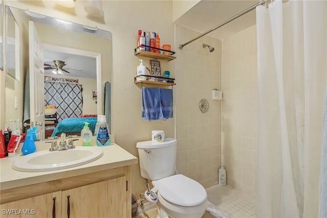 bathroom featuring vanity, tile patterned flooring, ceiling fan, toilet, and curtained shower