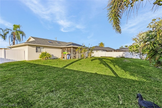 view of yard with a sunroom