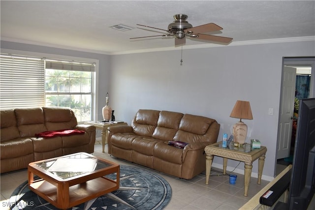 living room with ceiling fan, ornamental molding, and light tile patterned floors