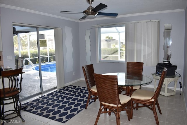 tiled dining area featuring ceiling fan and ornamental molding