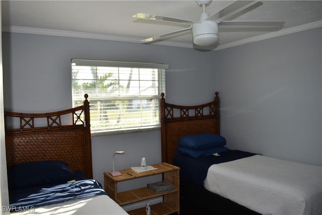 bedroom featuring ceiling fan and crown molding