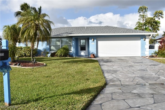 ranch-style house featuring a garage and a front lawn