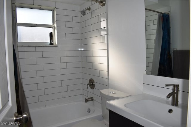 full bathroom featuring vanity, toilet, and shower / bath combo