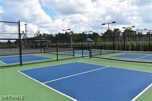 view of sport court with basketball hoop