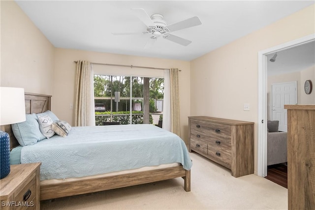 carpeted bedroom with access to exterior and ceiling fan