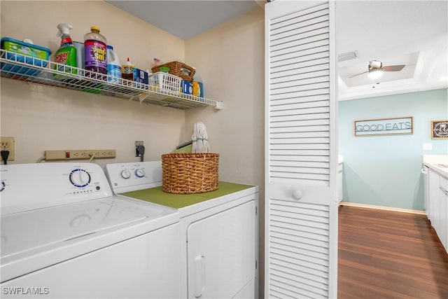 washroom with separate washer and dryer, ceiling fan, and dark wood-type flooring