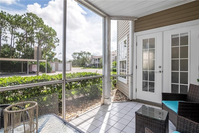 unfurnished sunroom with a wealth of natural light and french doors