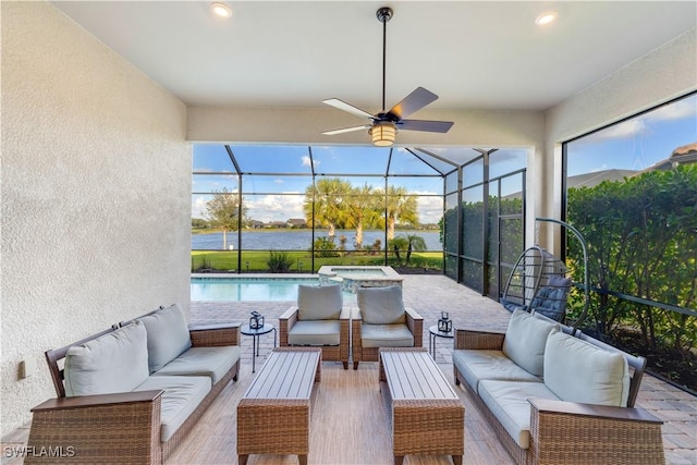 view of patio with a swimming pool with hot tub, an outdoor hangout area, a water view, and glass enclosure