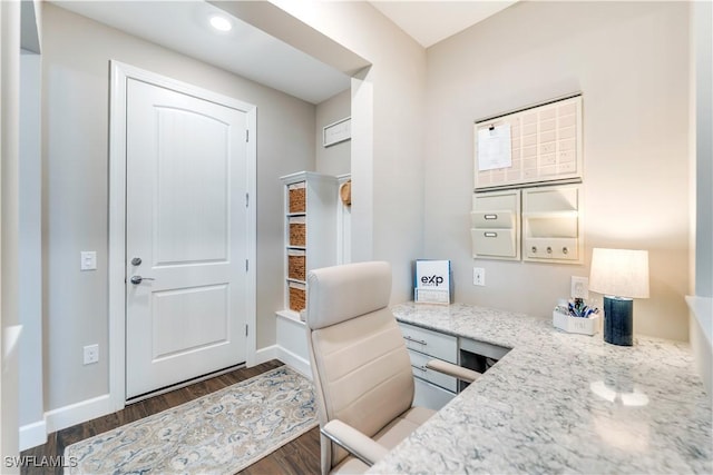 home office with dark wood-type flooring