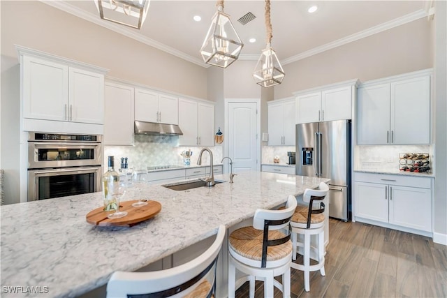 kitchen with white cabinets, sink, and stainless steel appliances