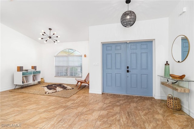 foyer with a chandelier