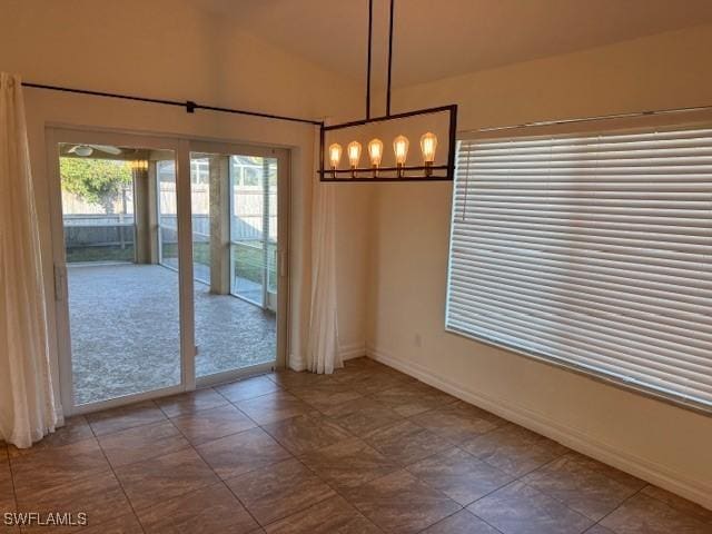 unfurnished dining area with lofted ceiling