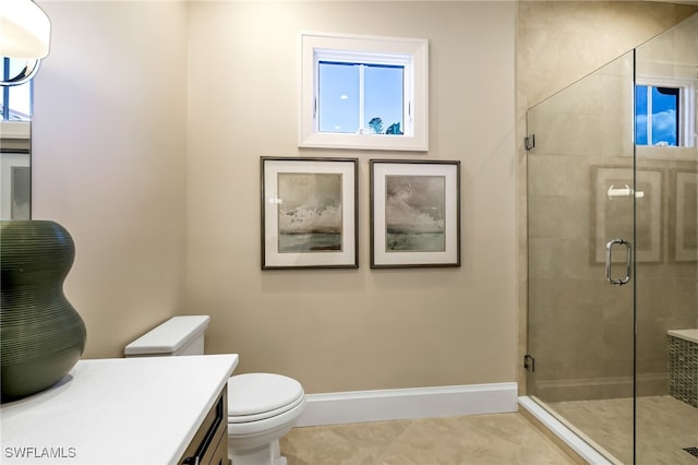 bathroom with tile patterned flooring, vanity, toilet, and walk in shower