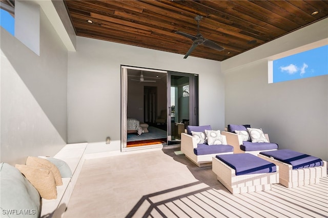 view of patio with ceiling fan and an outdoor living space