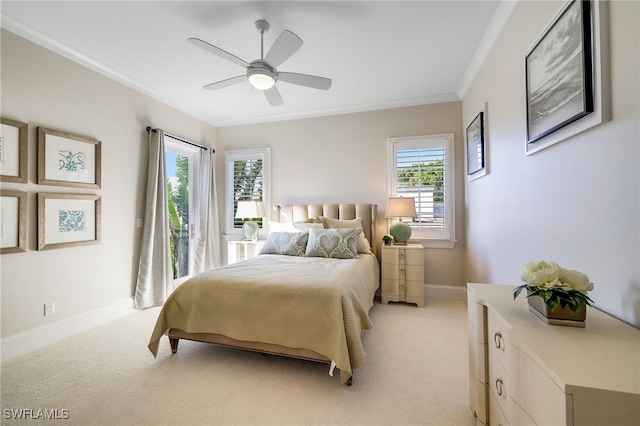 carpeted bedroom with multiple windows, ceiling fan, and ornamental molding