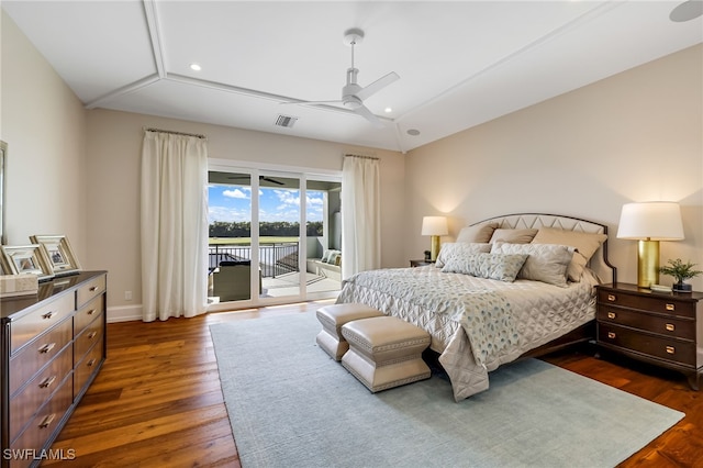 bedroom with ceiling fan, dark hardwood / wood-style flooring, access to exterior, and vaulted ceiling