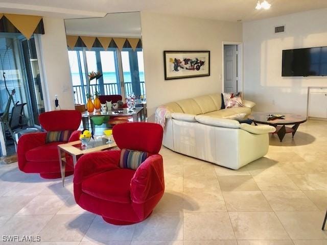 living room with light tile patterned floors