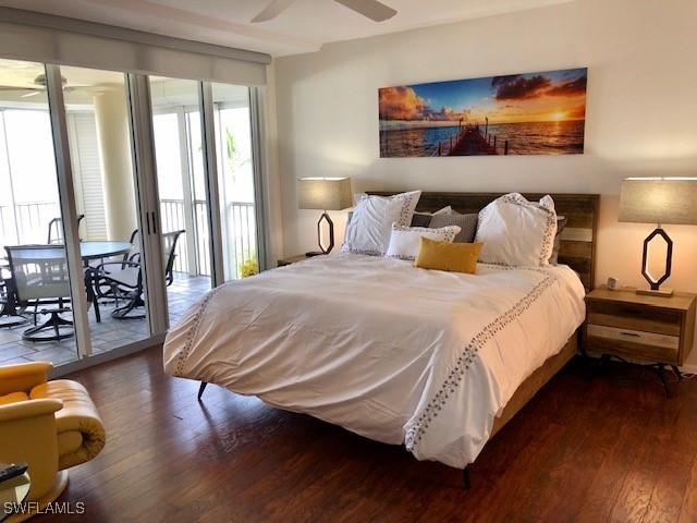 bedroom with access to outside, ceiling fan, and dark hardwood / wood-style floors